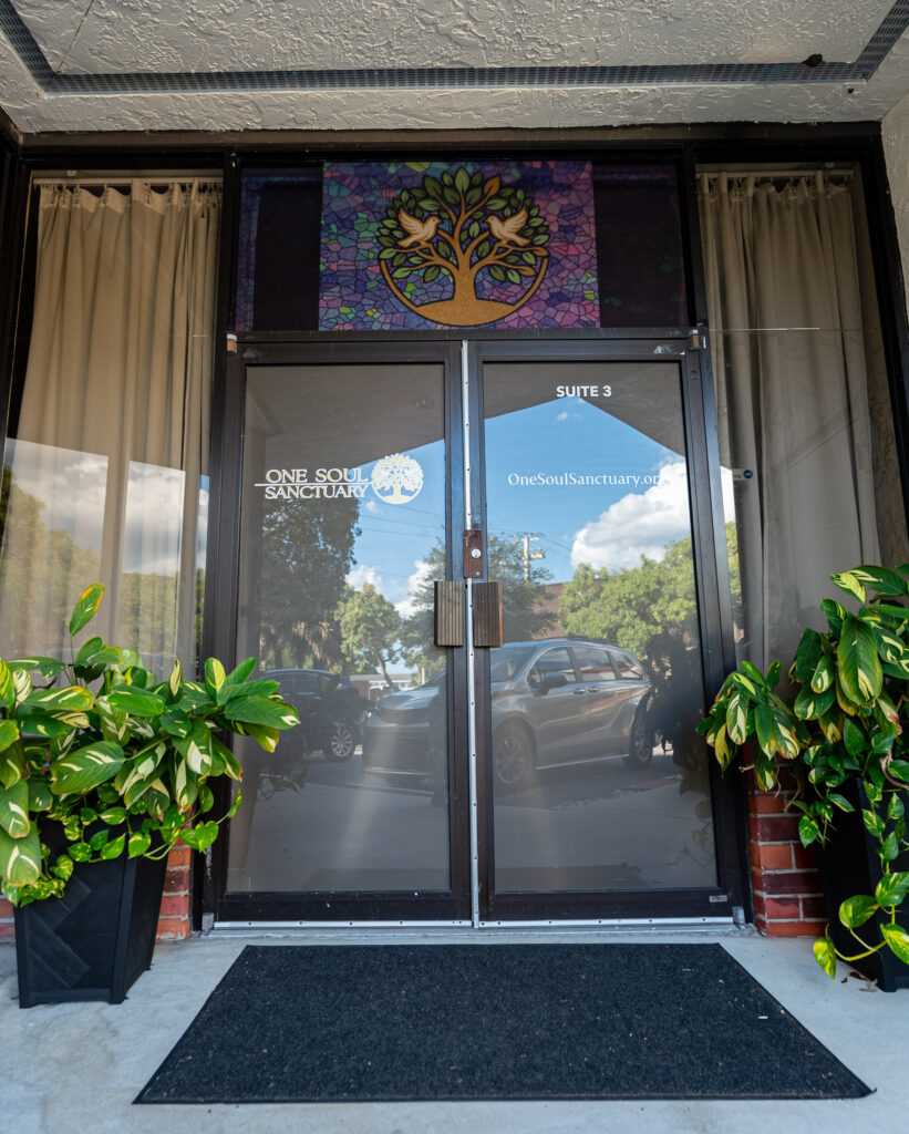 Glass doors of the Sanctuary looking out to greenery